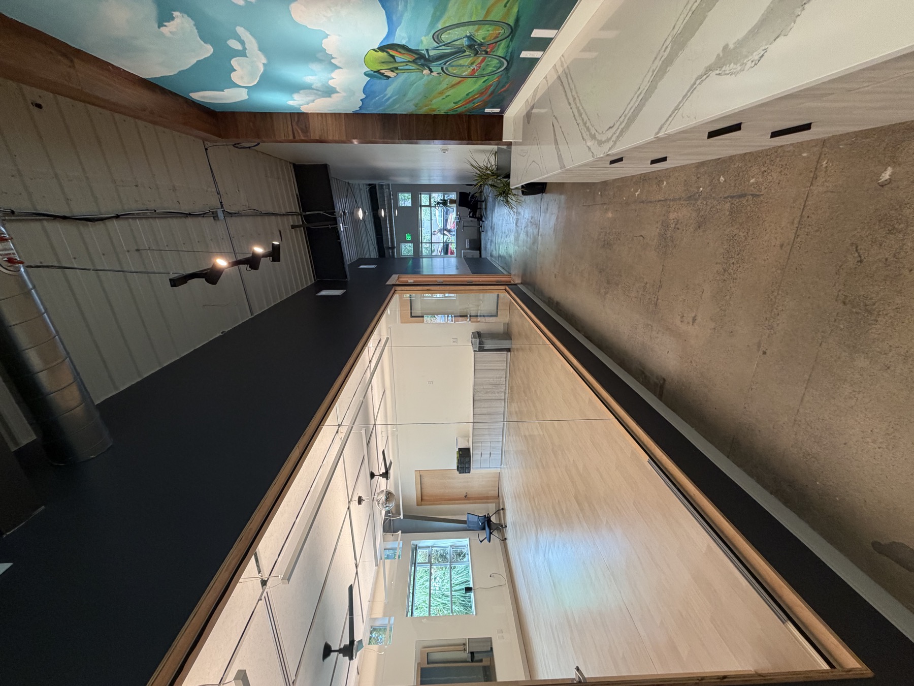 The mirrored studio seen from the hallway